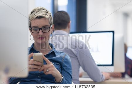 startup business, woman  working on dektop  computer at creative modern office relaxing and have fun