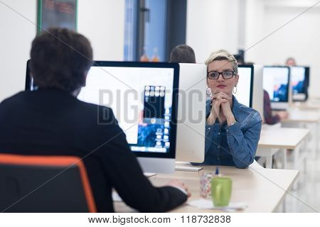 startup business, woman  working on dektop  computer at creative modern office relaxing and have fun