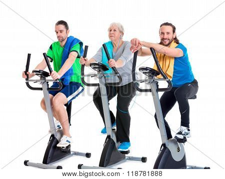 Female Senior Train With Fitness Machine And Using Phone