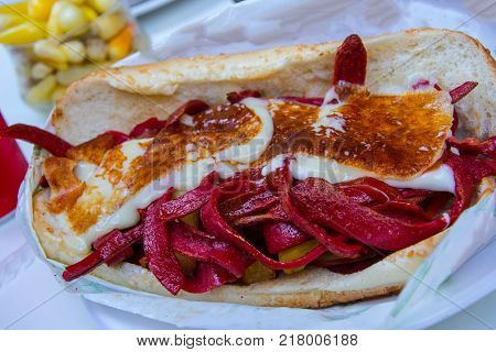 very delicious and so famous Izmir sandwich called kumru with cheese salad and sausage