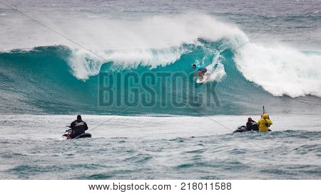 SUNSET BEACH HAWAII USA - DECEMBER 2, 2017: Surfer competing at the 2017 Vans World Cup of Surfing competition at Sunset Beach on Oahu's scenic North Shore. This is the second of three surfing competitions and Conner Coffin took first place.
