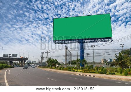 Blank billboard with green color background for new advertisement under the blue sky advertise concept, 3D illustration