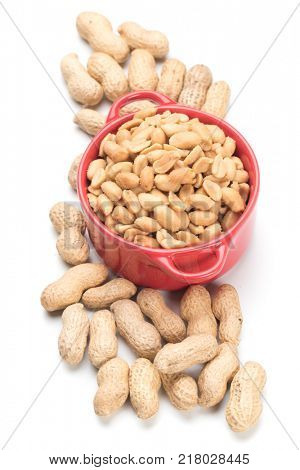 Roasted peanuts with peanut shells isolated on white background