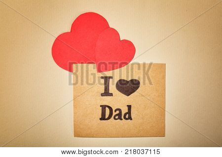 Composition with phrase I LOVE DAD for Father's Day on craft paper