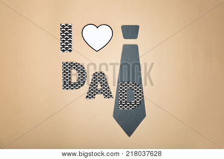 Composition with phrase I LOVE DAD for Father's Day on craft paper