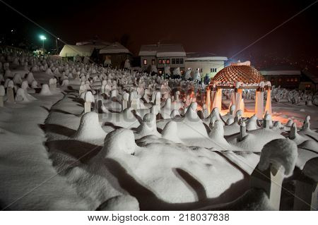 Mystical graveyard memorial in winter snow night