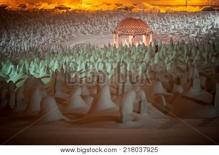 Mystical graveyard memorial in winter snow night