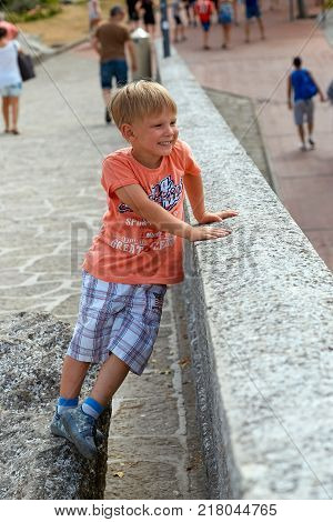 San Marino, San Marino - July 10, 2017: Tourist The Boy Walks Along The Historical Site.