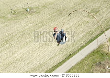 Belarus Gomel May 06 2017.Jumping with a rope.Extreme man jumping from a huge height.Jumping with a rope.Flight down on the rope.Engage in ropejumping.Dangerous hobbies