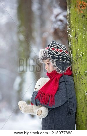 Sad Lost Child, Boy In A Forest With Teddy Bear, Wintertime