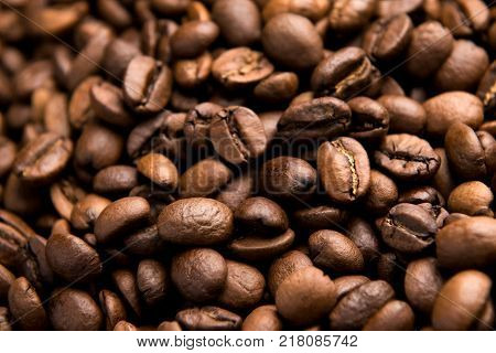 Fresh roasted arabica coffee beans background.
Beautiful arabica coffee beans has very strong smell and excellent taste!Every coffee bean is unique.