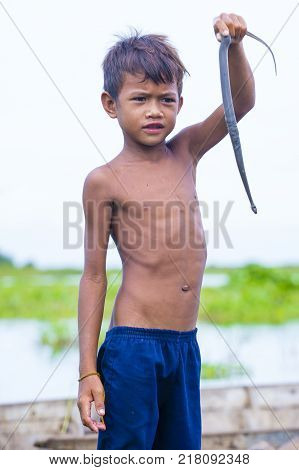 Tonle Sap Cambodia - Oct 18 : Cambodian Child In Tonle Sap Lake Cambodia On October 18 2017. Tonle S