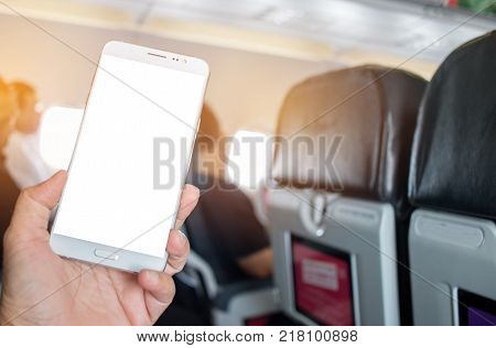 Business people hands holding use smart phone in airplane blurred background mockup blank adverising template. insert for text of customer. Space for texting in your products or promotional.