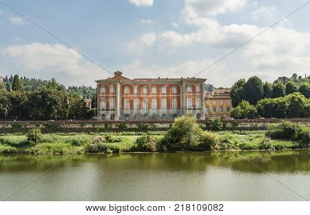 Scenic view of the Lungarno at historic center of Florence Italy. Facades of old medieval houses on waterfront of the Arno River. Florence is a popular tourist destination of Europe.