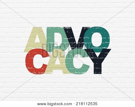Law concept: Painted multicolor text Advocacy on White Brick wall background