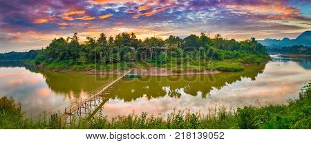 Beautiful view of a bamboo bridge. Luang Prabang. Laos landscape. Panorama