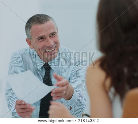 boss discusses with the assistant business documents in the offi