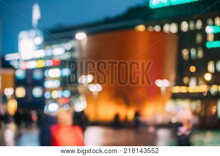 Helsinki, Finland. Natural Defocused Bokeh Background Of Kamppi Chapel In Narinkka Square. Boke Lights Illumination.
