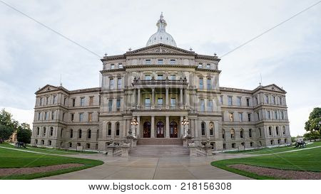 Lansing State Capitol Building in Michigan after a rainy day with the clouds still out. A panorama of the building to show more scale.