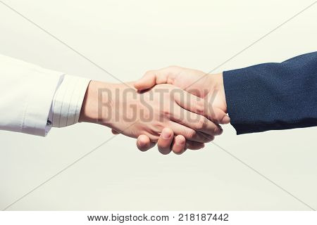 Man doctor and her lawyer shaking hands on white. shaking hands doctor. shaking hands business.