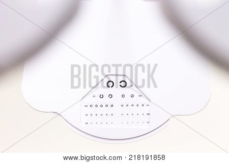 the cabinet of the eye doctor. eye sight test called landolt C. with copy space