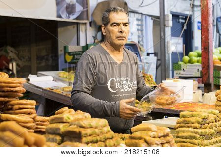 TEL AVIV , ISRAEL - 21 NOVEMBER 2017: Sellers on the old grocery street Nahalat-Benjamin