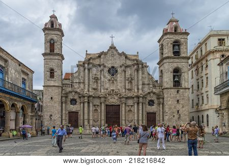2015-12-05 Tourists and locals in Cienaga Square in old Havana near the Cathedral of St. Christopher. Today the cathedral is one of 11 active Roman Catholic churches of the island.