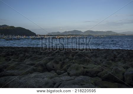 INDONESIA: Scenery of Tanjung Papuma Beach with rock and mossy foreground. Papuma beach is located at Jember,Surabaya, East Java.