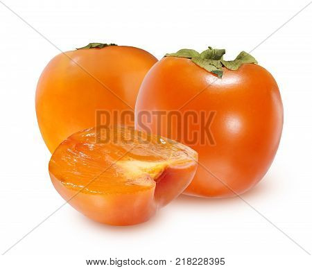 honeyed persimmon isolated on a white background. Two whole fruit and half with shadow.
