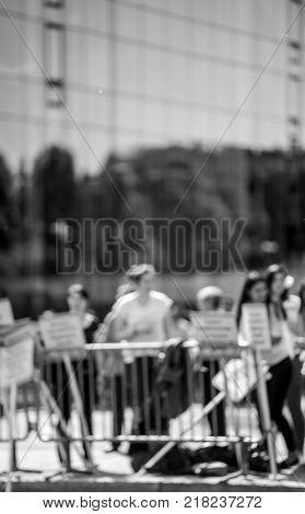 Defocused protesters behind fence at protest in France
