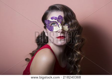 Beautiful Woman Holdind A Carnival Mask. Halloween Holiday Concept.