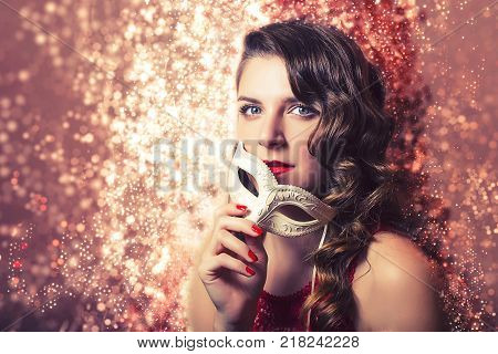 Beautiful Woman Holdind A Carnival Mask. Halloween Holiday Concept.