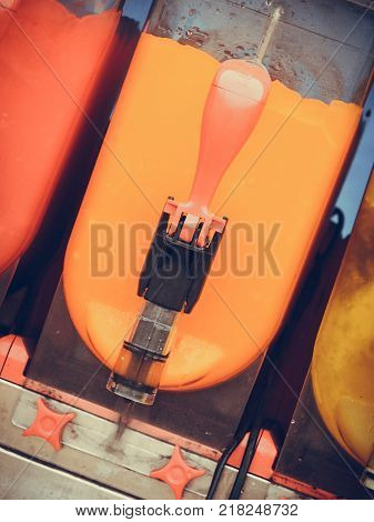 Food cold sweet desert summertime pleasure concept. Colorful ice cream slushy smoothie machine