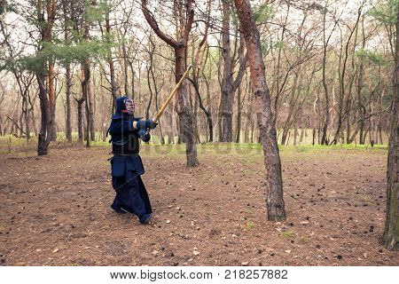 Man In A Traditional Armor Is Practicing Martial Arts, Kendo