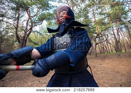 Man In A Traditional Armor Is Practicing Martial Arts, Kendo