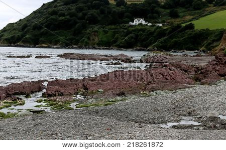 The pebbled beach of Talland Bay in Cornwall