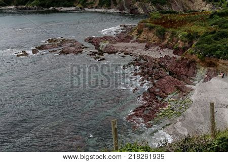 The rocky shores of Talland Bay in Cornwall