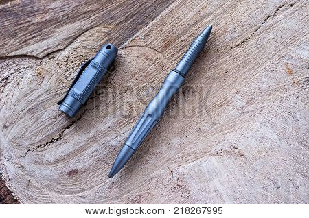 Metal Ball Pen On A Wooden Stump.