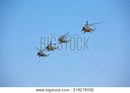 Military helicopters against the blue sky. Helicopter in flight