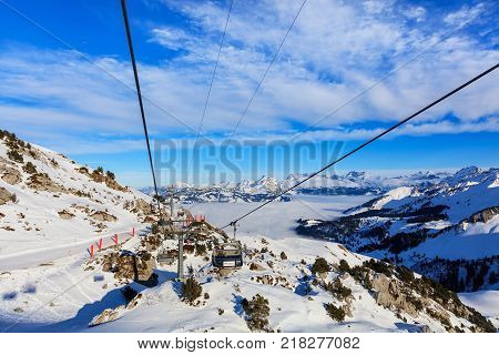Mt. Fronalpstock, Switzerland - 24 January, 2017: overhead cable car on the Fronalptsock mountain in winter. The Fronalpstock is a mountain in the Swiss canton of Schwyz, it has an elevation of 1,921 meters above sea level.