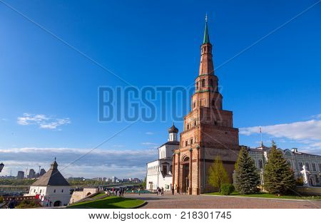 KAZAN, TATARSTAN, RUSSIA - MAY, 8 2016: Visitors walking along leaning Soyembika Tower (Khan's Mosque), the most familiar landmark and architectural symbol of Kazan.