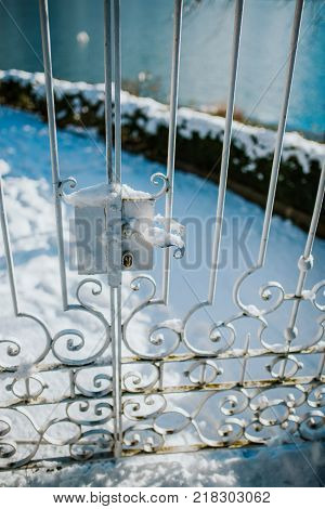 Old metal doors under the snow. Way to the garden.