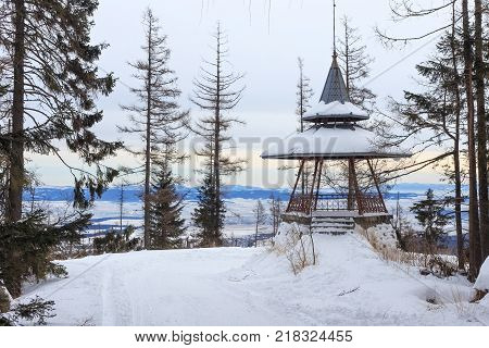 Wooden viewpoint in the popular ski and hiking Hrebienok resort (altitude 1285 m.) located in the High Tatras mountains National park. Slovakia.