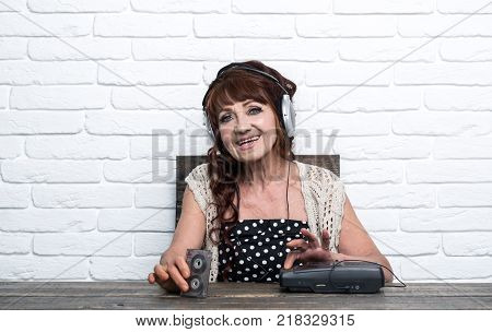 Old school music player radio. Audio book and new technology education. Spy and operator. happy granny dj in headset with cassette player. Old woman with cassette recorder listen music in headphones