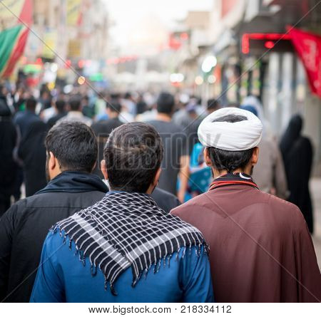 Pilgrims in Karbala walking towards The Holy Shrine of Imam Hussain