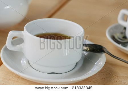 the image white Cup on table in cafe