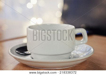 the image white Cup on table in cafe