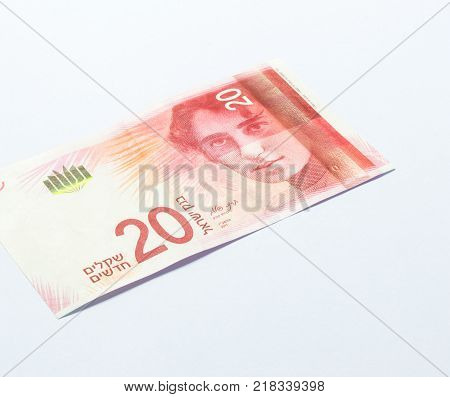 One banknote of a new type with a portrait of singer Rachel Bluwstein worth 20 Israeli shekels isolated on a white background