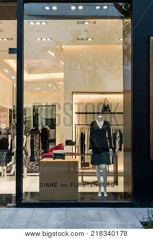 Diane Furstenberg shop at Emquatier, Bangkok, Thailand, Oct 15, 2017 : Luxury and fashionable brand window display. New collection of black clothings and clutch bag showcase at flagship store.