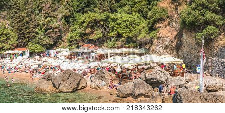 Budva, Montenegro - August 18, 2017: Fragment of Mogren beach in Budva, Montenegro is one of the most popular beaches on the Budva Riviera.